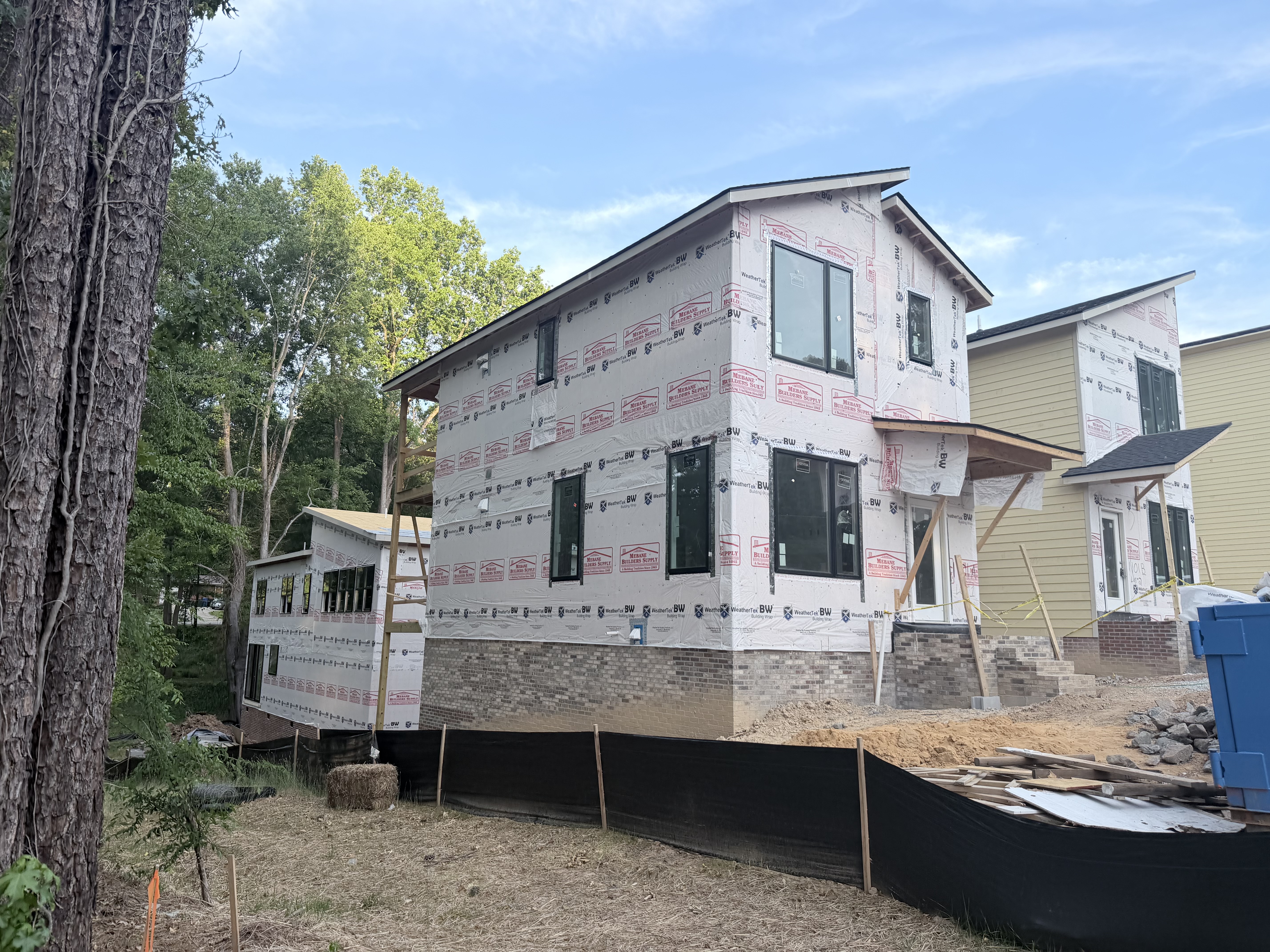 Front elevation of Lot 3 showing brick base and large window bank
